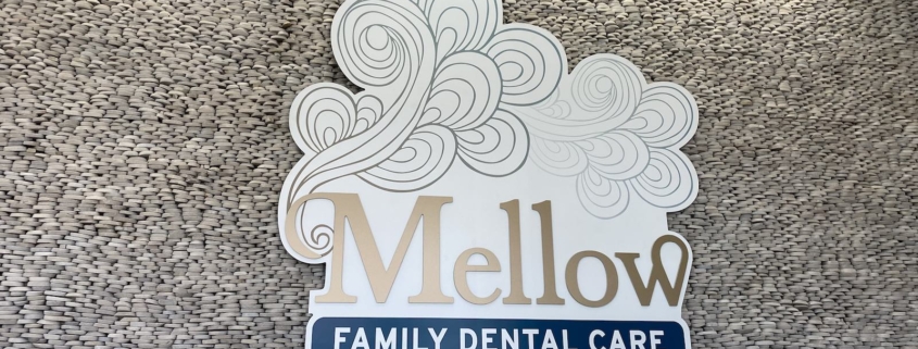 Mellow Family Dental Care logo featuring stylized cloud art and modern blue typography.
